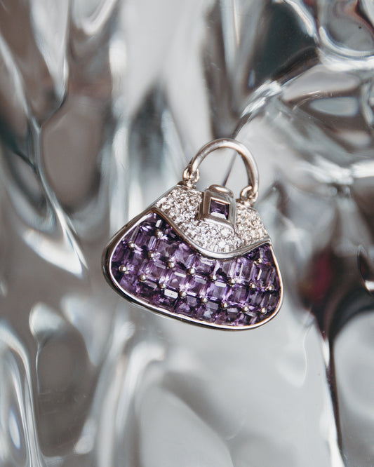 Front view of Minaudière 18K White Gold Amethyst Evening Locket on display