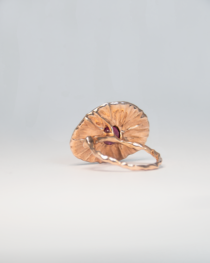 Back view of Nisi Island Ring in 18K Rose Gold featuring Gold-Sheen Sapphire decorated with Pink Tourmaline