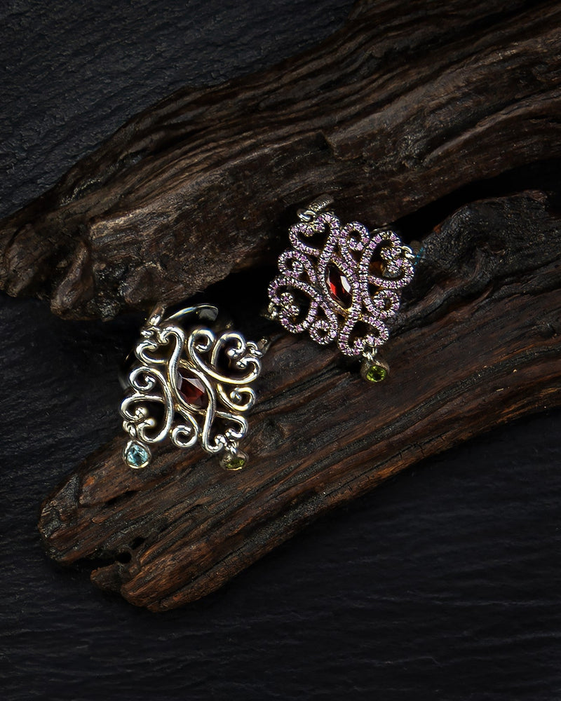 Regal Fantasy rings on wood and black slate