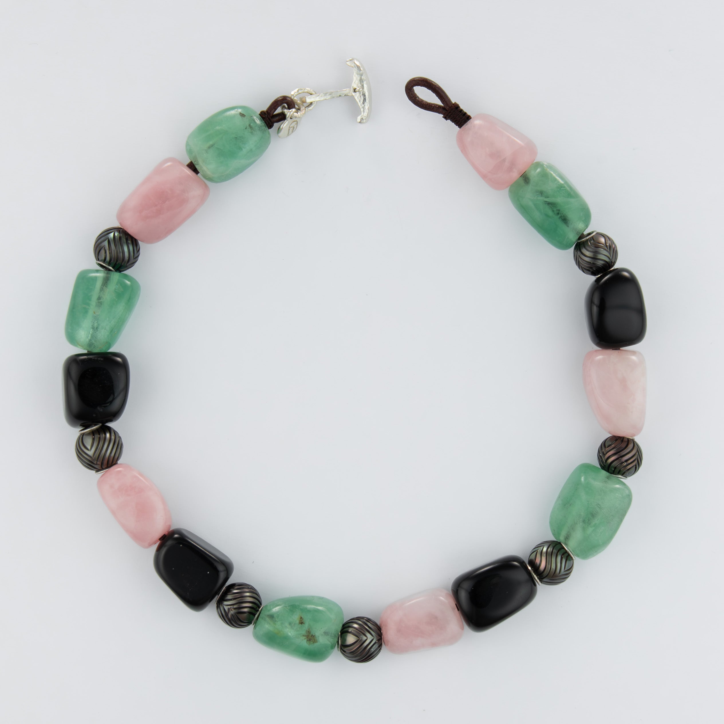 Necklace with multicolored beads on a white background