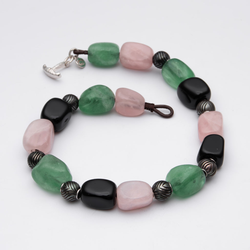 Necklace with multicolored beads on a white background