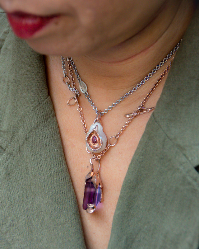 Outdoor session showcasing layered necklaces designed by TVRRINI.