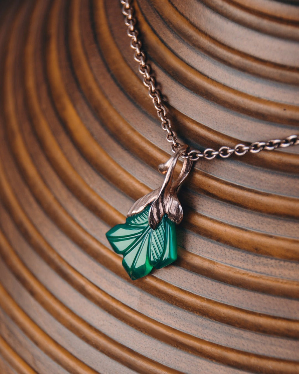 Kara Green Agate Pendant on wooden vase