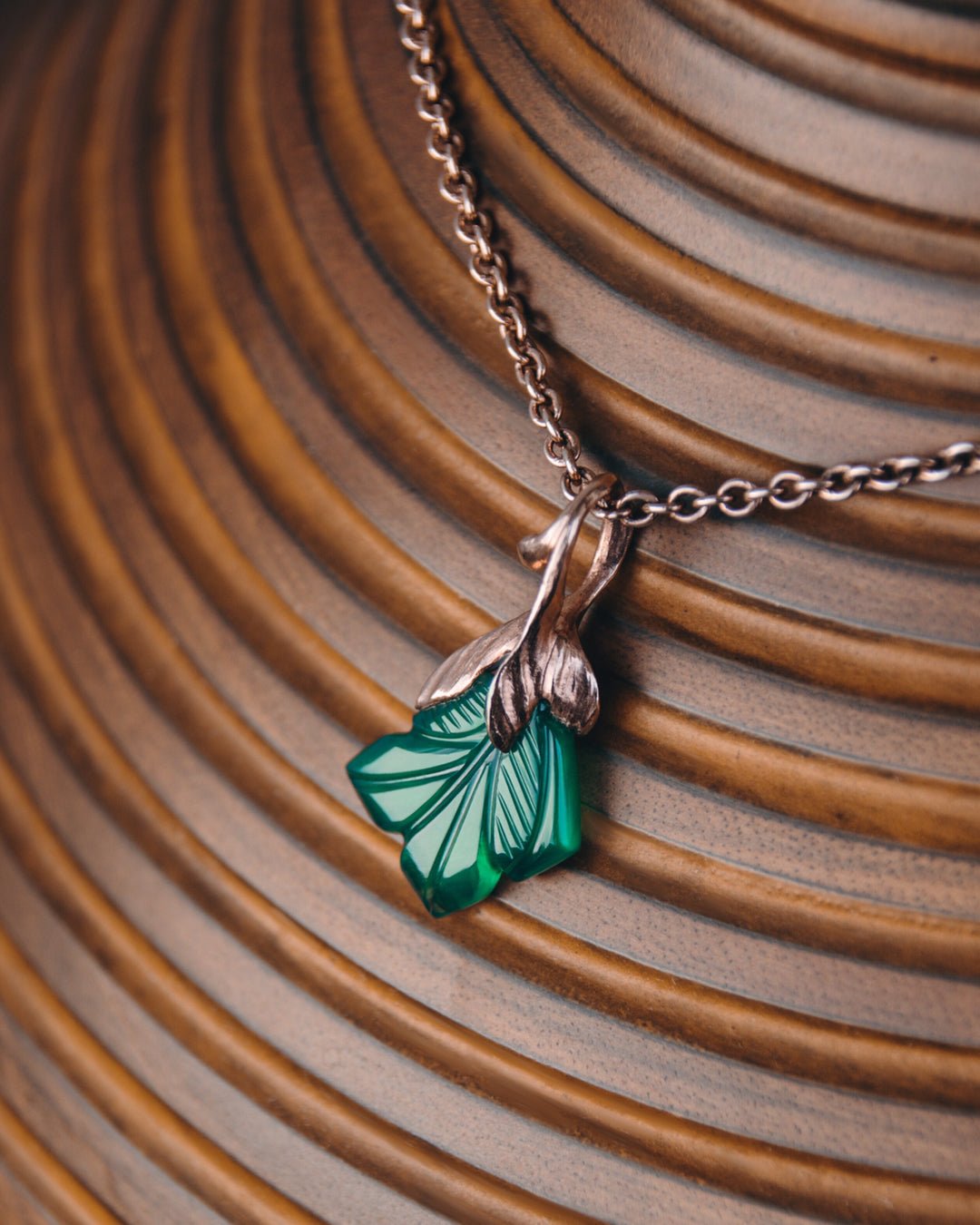 Kara Green Agate Pendant on wooden vase
