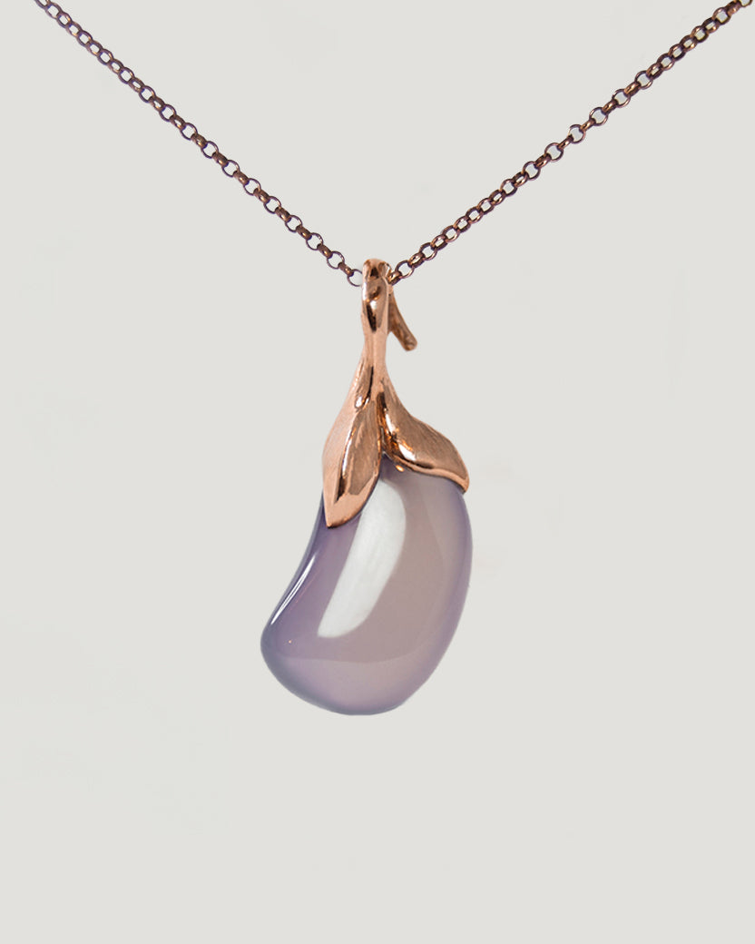 reverse side of pendant resembling an aubergine, highlighting the pastel colours and comforting shape