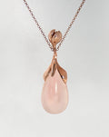 front view of a gold-plated silver pendant with a flower design, featuring a rose quartz teardrop cabochon