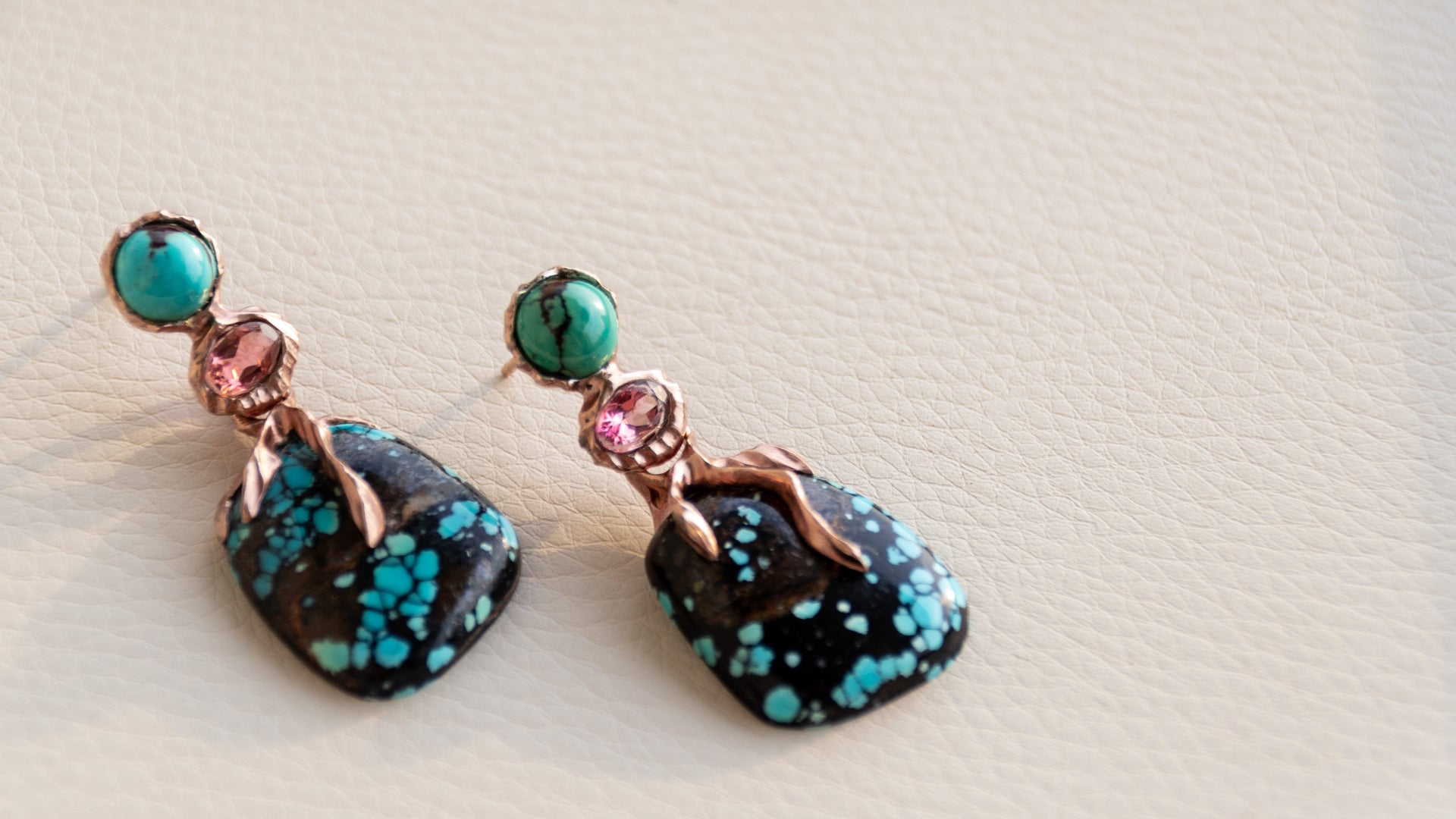 A unique pair of Lava Drop Earrings on jewellery tray