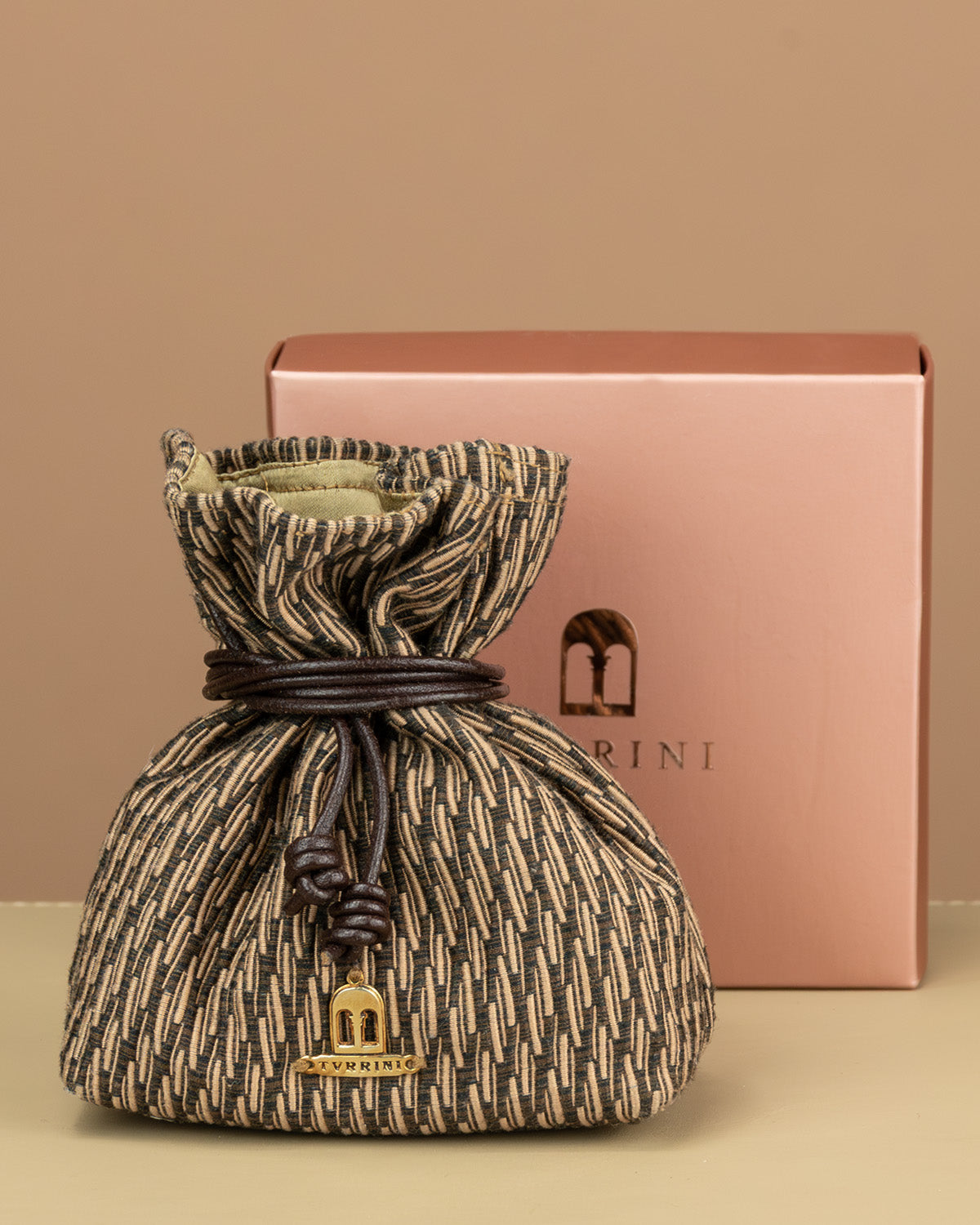 Jewellery pouch and branded pink metallic coloured box