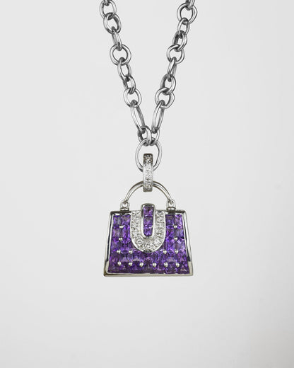 front of a 18K white gold with amethyst and diamond handbag locket pendant on signature TVRRINI chain