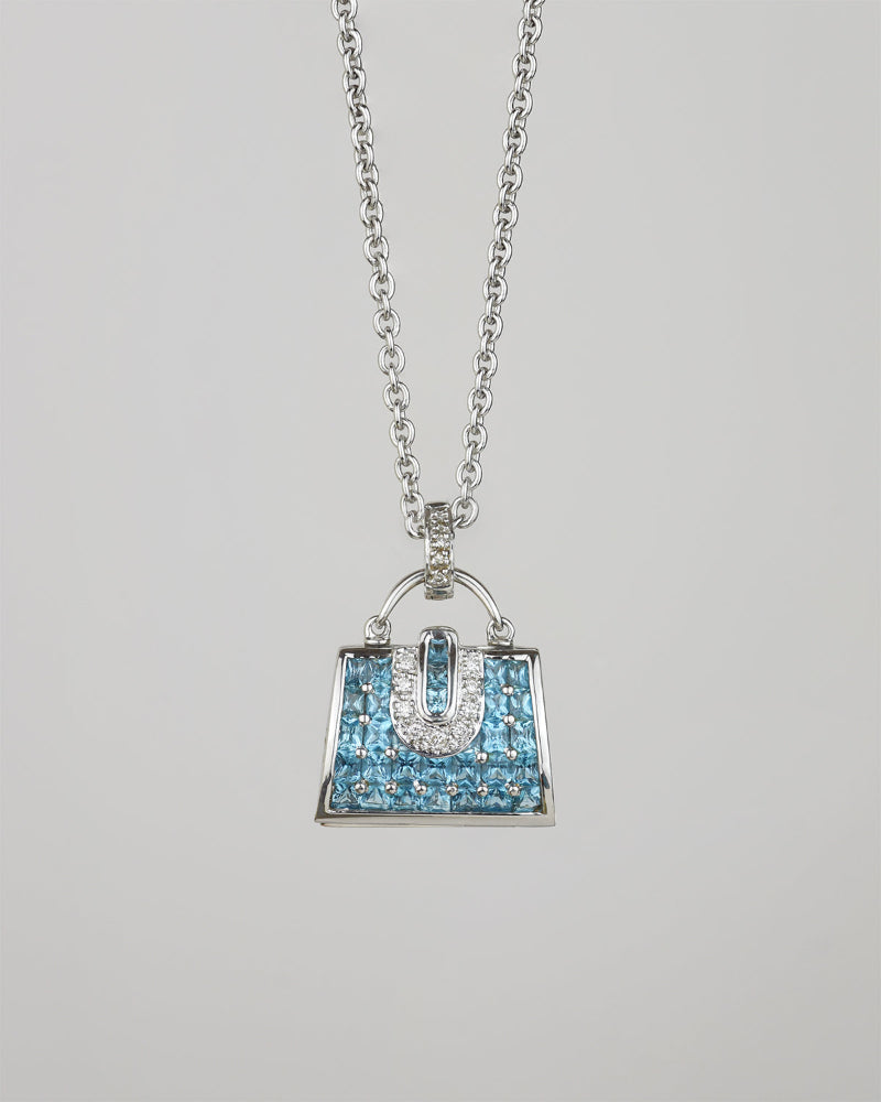 Unique TVRRINI 18K white gold with blue topaz and diamond handbag locket pendant