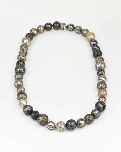 18-inch necklace featuring hand-crafted Tahitian pearls with different colours and patterns