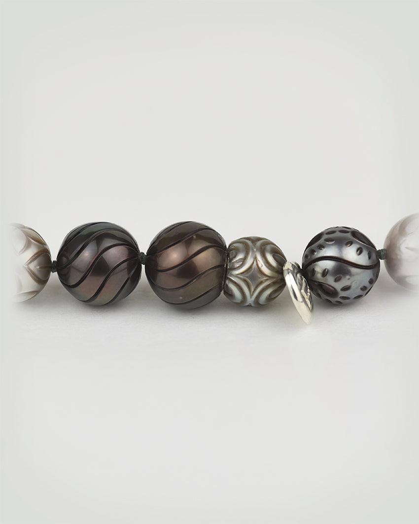 Close-up of a crafted Tahitian Pearl necklace, showcasing bottle gourd-inspired shape of magnetic closure