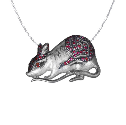 Rat Pendant in Sterling Silver adorned by Rubies, displayed on a link chain.