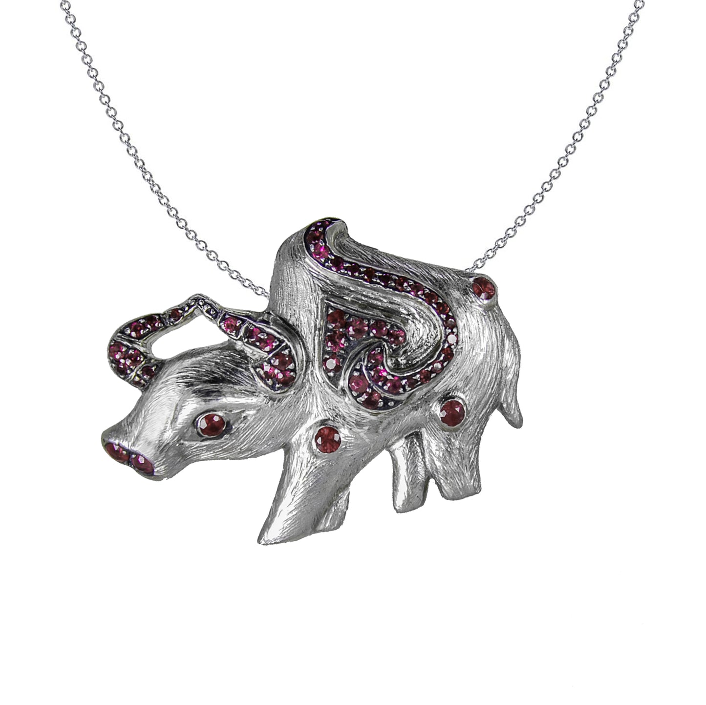 Ox Pendant in Sterling Silver adorned with Rubies decorating the eye, nose and horns, and a ruyi motif, displayed on a chain.