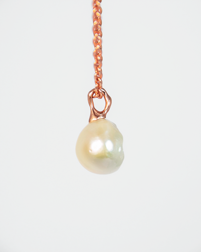 Side View of Nisi Cove Pendant with Round Pearl in 18K Rose Gold
