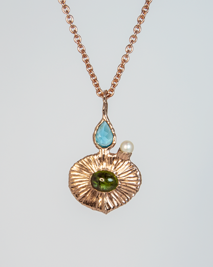 Front view of Nisi 18K Rose Gold Pendant on Green Tourmaline side with Blue Topaz and Freshwater Pearl