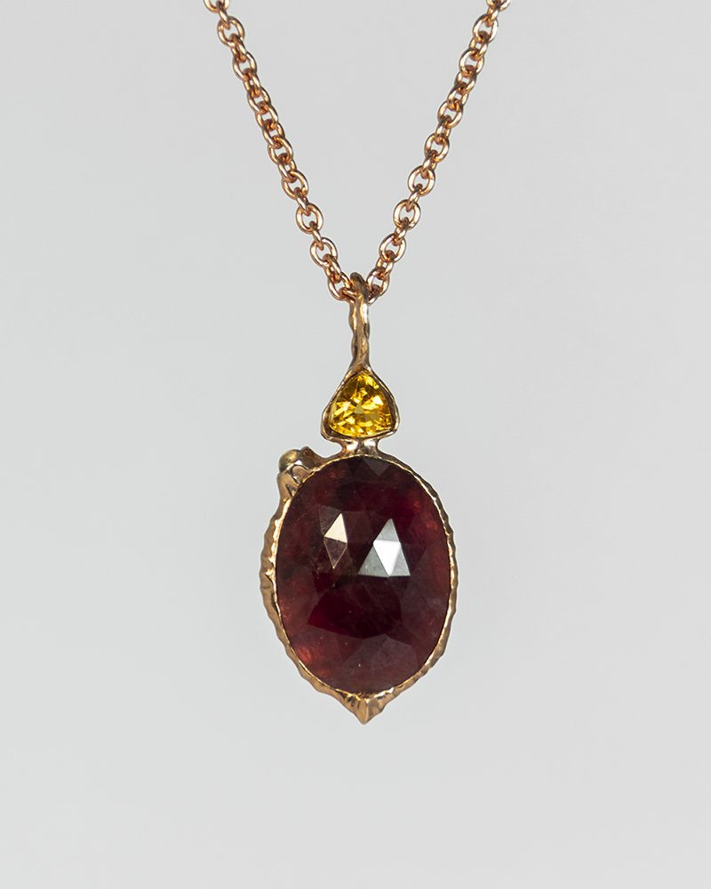 Front view of Nisi Vessel Pendant in 18K Rose Gold with Ruby & Green Tourmaline on 18K Rose Gold Chain