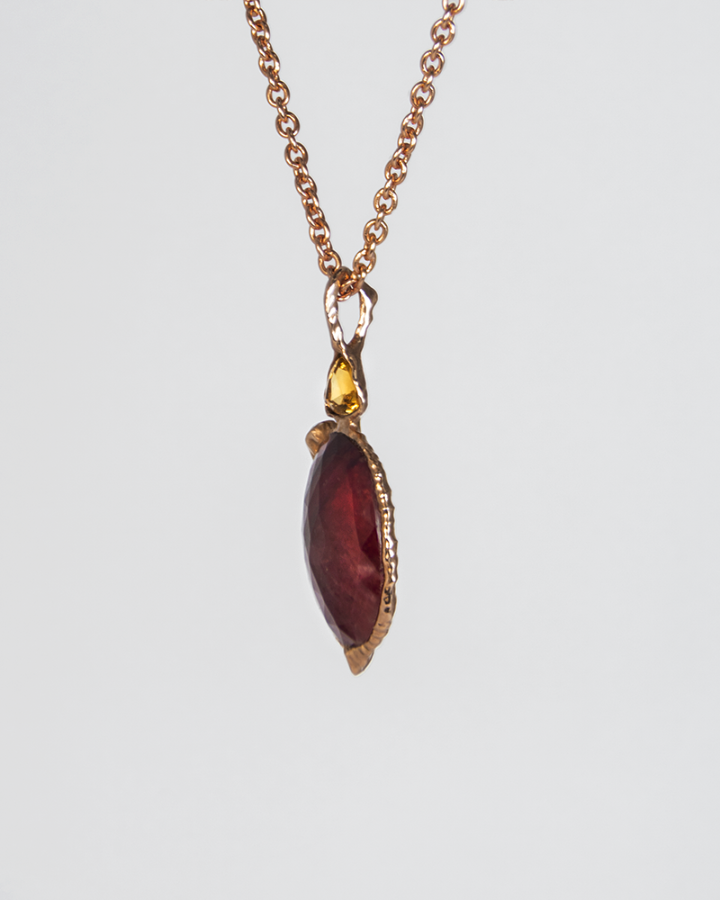 Sculpted detail of Nisi Vessel Pendant in 18K Rose Gold with Ruby & Green Tourmaline on 18K Rose Gold Chain