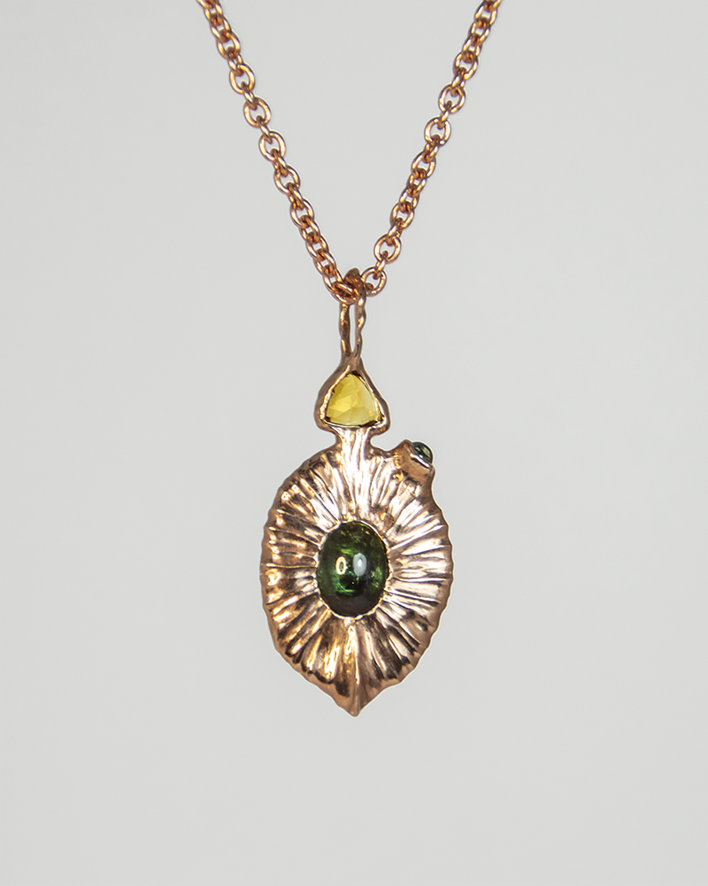 Back view of Nisi Vessel Pendant in 18K Rose Gold with Ruby & Green Tourmaline on 18K Rose Gold chain
