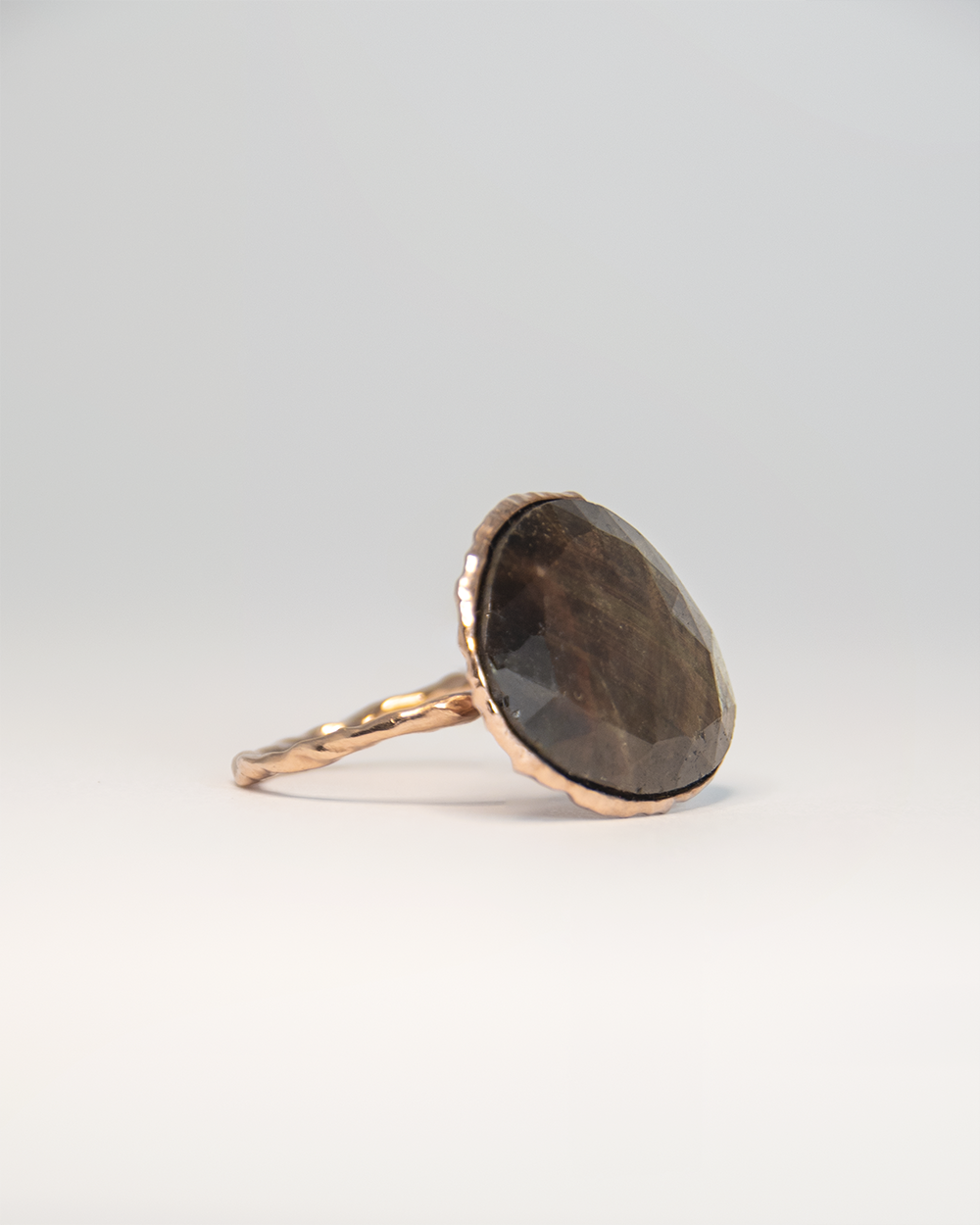 Alternative angle of Nisi Island Ring in 18K Rose Gold with Gold-Sheen Sapphire