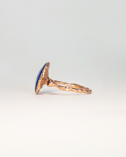 Side view of Nisi 18K Rose Gold ring featuring Lapis Lazuli with round faceted Ruby as accent stone