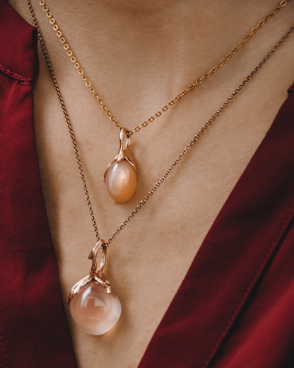 Editorial THP987RG Kara Pendant with Square Cabochon Rose Quartz set in 18K Rose Gold with THP989RG Kara Pendant with Oval Cabochon Peach Moonstone set in 18 K Rose Gold