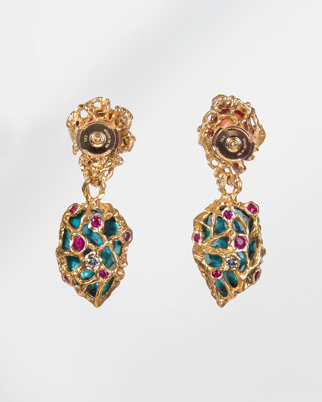 Back view of 18K Rose Gold earrings with textured details that reveal spider-web Turquoise