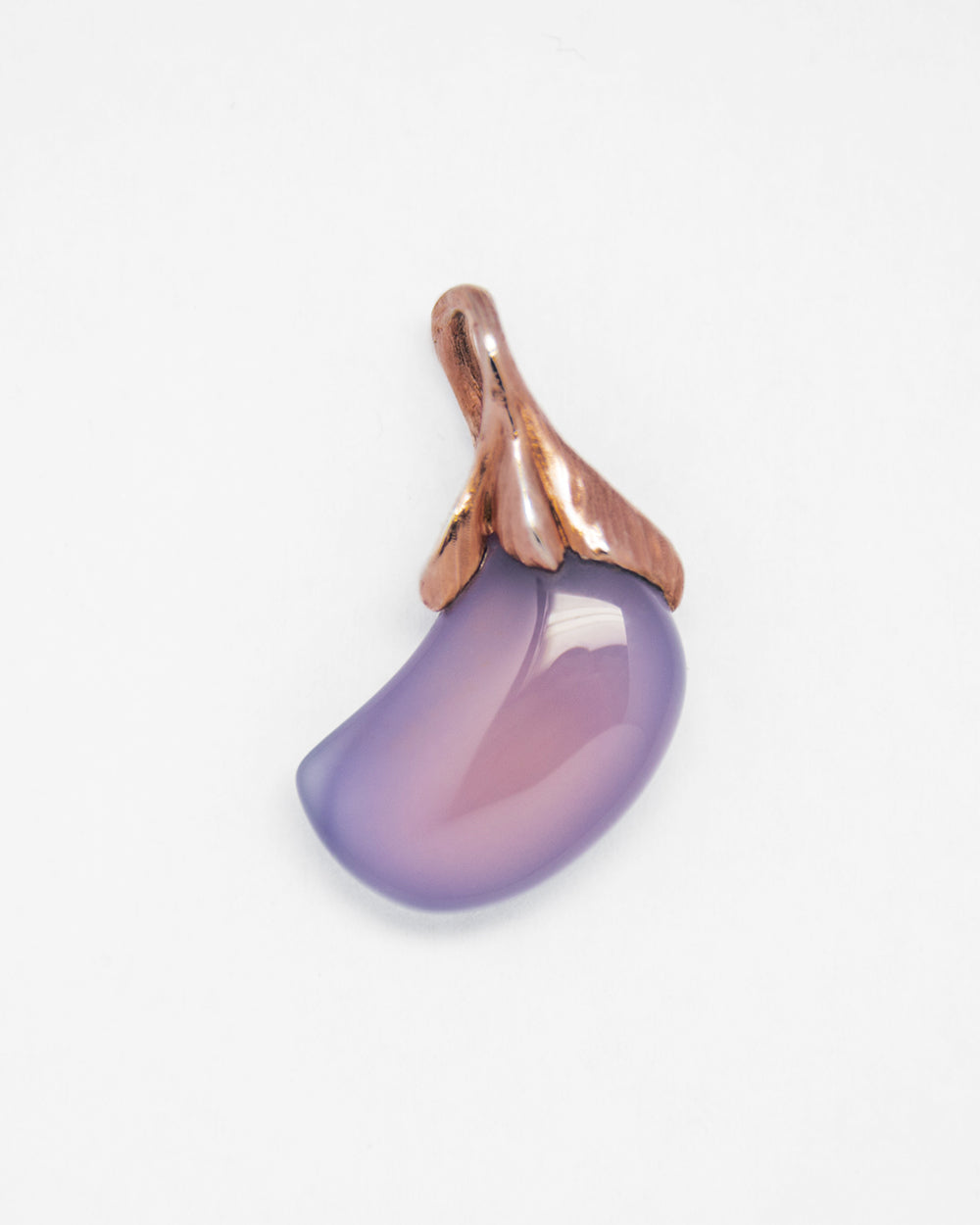 reverse of a purple chalcedony pendant featuring a sculpted, free-form setting in rose gold-plated sterling silver