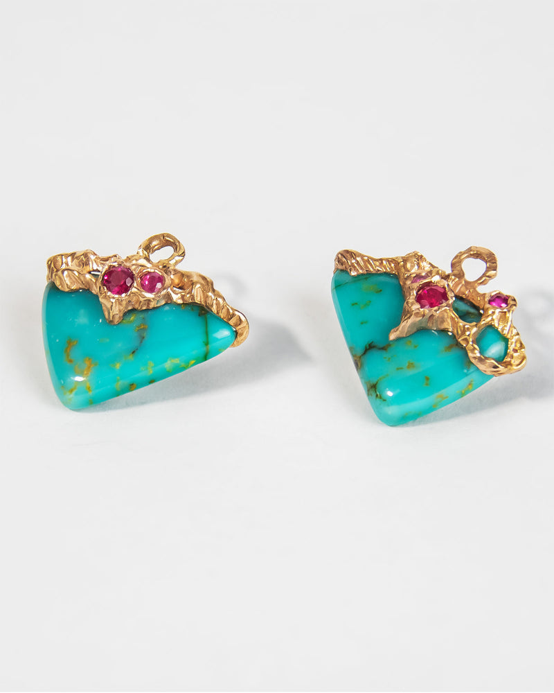 angled view of detachable drops featuring turquoise and rubies set in molten 18K rose gold setting