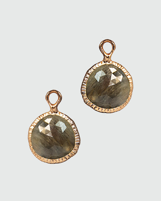 front of Nisi Pebble detachable drops featuring green-grey sapphires framed set in a free-form gold-plated silver setting