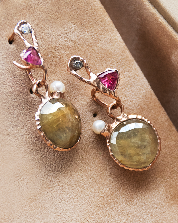 angled view of detachable drops with yellow sapphires and freshwater pearls set in gold-plated silver matched with hoop earrings featuring pink tourmaline and diamond in a free-form gold-plated silver design