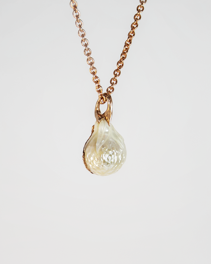 back of a pendant with a free-form bail holding the pearl in place