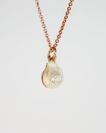 back of a pendant with a free-form bail holding the pearl in place