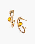 A pair of hoop earrings featuring citrine and diamonds framed in a free-form gold-plated silver setting