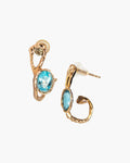 A pair of gold-plated silver hoop earrings with a free-form sculpted design showcasing blue topaz and diamonds