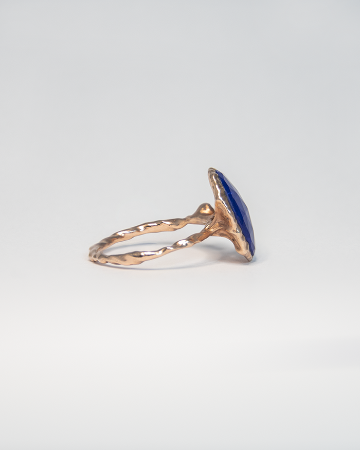 side view of 18K rose gold-plated silver ring, highlighting the asymmetrical band design