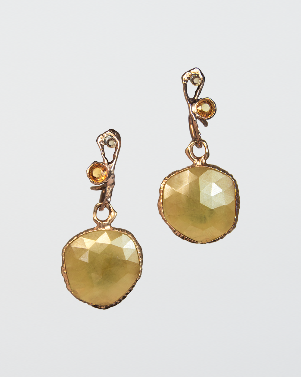 TVRRINI signature earrings strung with detachable Nisi Pebble Earring Charms for a bolder impact