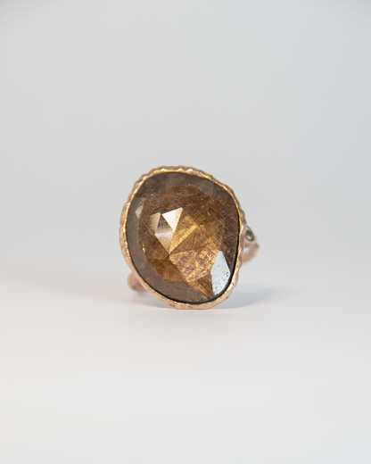 Front view of Nisi Island Ring in 18K Rose Gold with Gold-Sheen Sapphire accented by Dusty Diamonds