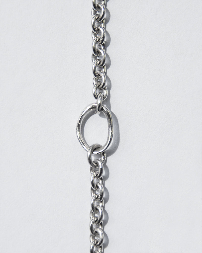 close-up of 18-inch white gold chain necklace emphasising its adjuster loop at the 16-inch mark