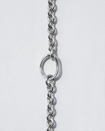 close-up of 18-inch white gold chain necklace emphasising its adjuster loop at the 16-inch mark